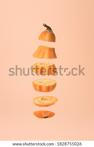 Infographic design of sliced pumpkin levitating. Minimal Autumn of Fall background. Food deconstructed food styling concept.