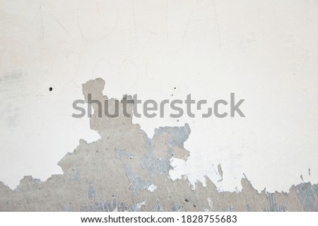 paint peels off the wall. peeling paint background. plaster walls. building construction and repair. copy space background.