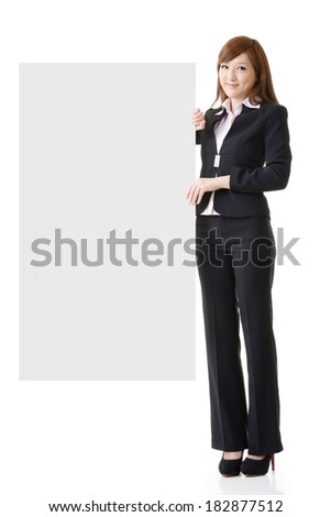 Asian business woman hold empty blank board, full length portrait isolated on white background.