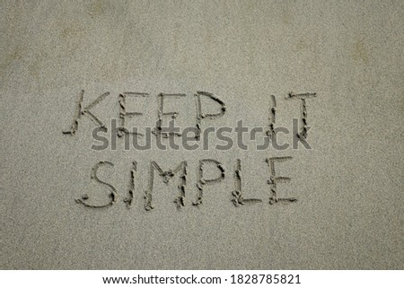 Keep it simple. Inspiration and motivation quote 'keep it simple' with red leaf background