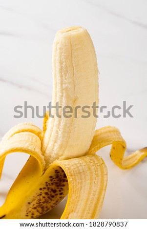 half peeled banana close-up picture