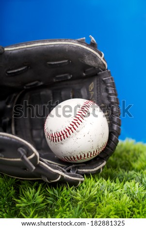Baseball and Glove on Grass