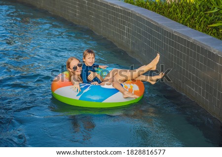 Mom and son have fun at the water park