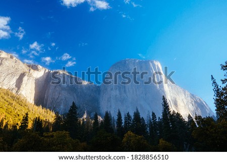 The view from within Yosemite Valley of surrounding rock faces on a stormy day in California, USA Royalty-Free Stock Photo #1828856510
