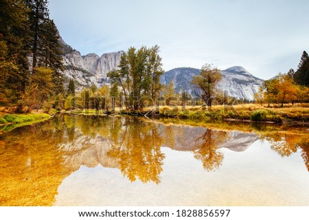 The view from within Yosemite Valley of surrounding rock faces on a stormy day in California, USA Royalty-Free Stock Photo #1828856597