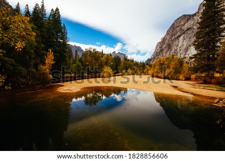 The view from within Yosemite Valley of surrounding rock faces on a stormy day in California, USA Royalty-Free Stock Photo #1828856606