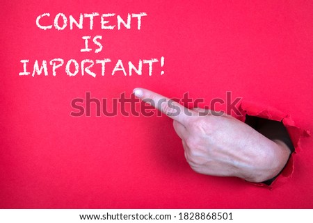 CONTENT IS IMPORTANT. Hand finger pointing on red background.