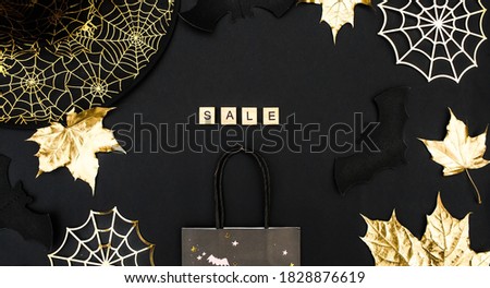 Banner.Modern background with bats, Golden leaves and cobwebs.The inscription in English: "sale".Halloween online shopping. Holiday sales, seasonal sales, Black Friday, discounts, and shopping on site