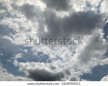 Clouds white on a sultry rainy day with blue sky background.no focus