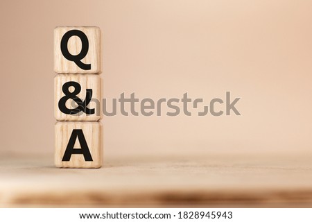 Close-up Shot of Q and A wooden blocks.