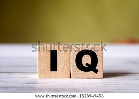 IQ word concept on wooden cube.  Intelligence symbol. Brain or talent background.