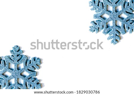 Two silver blue beautiful decorative snowflakes isolated on white background. New year and christmas background