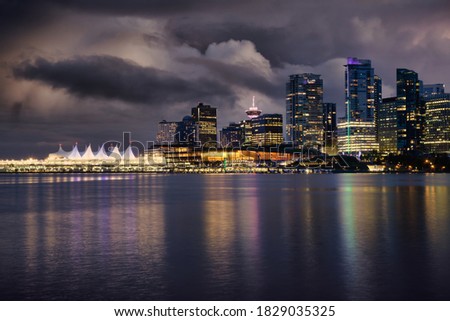 View of Coal Harbour in Downtown Vancouver, British Columbia, Canada, after Sunset. Modern City Skyline during Night