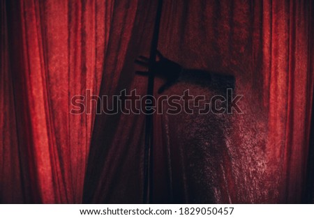 Horror woman in window wood hand hold cage scary scene halloween concept Blurred silhouette of witch. Horror theme
