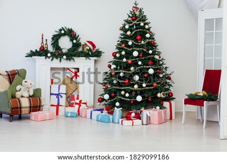 Christmas tree with fireplace interior of white room new year decoration garland gifts