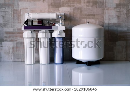 Reverse osmosis water purification system at home. Installed water purification filters. Clear water concept Royalty-Free Stock Photo #1829106845