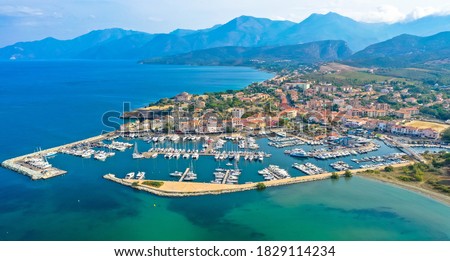 Aerial view of the village of Saint Florent, Corsica. Harbor boats and houses. Saint-Florent or San Fiurenzu in corsican, is a commune in the french department of Haute-Corse region of Corsica.  Royalty-Free Stock Photo #1829114234