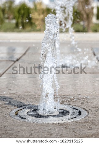 Close-up of an fountain with dripping water and blurred background