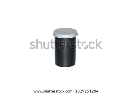 Black plastic film case with grey cap. Body for the photo film. Isolated on white background