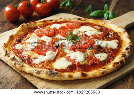 Fresh Homemade Italian Pizza Margherita with buffalo mozzarella and basil Royalty-Free Stock Photo #1829205563