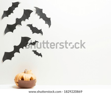 Halloween pumpkin with bats isolated on
White background. Pumpkins in medical masks due to the coranovirus epidemic covid 19