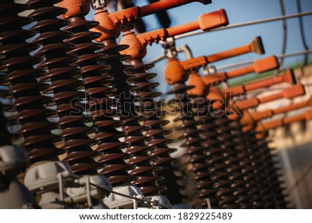 Detail of high voltage circuit breaker in a power substation. Royalty-Free Stock Photo #1829225489