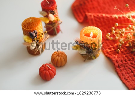 Autumn composition with candles.  Autumn, fall still life. Hygge lifestyle, cozy home decor. Happy Thanksgiving, Halloween background. Flat lay, top view