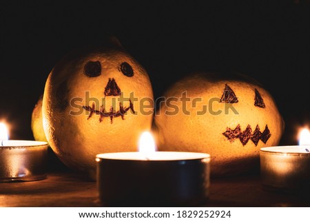 halloween pumpkin and candles with dark isolated background