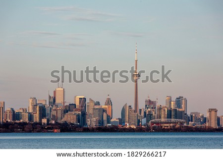 Toronto skyline at sunset across Lake Ontario