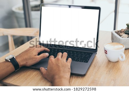 computer mockup blank screen.hand woman work using laptop with white background for advertising,contact business search information on desk at coffee shop.marketing and creative design