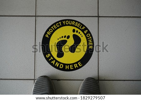 Notice in The Floor Protect Your Self & Other Please Stand Here