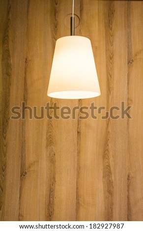 The lamp with wooden wall