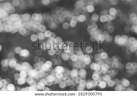 blurry background, bokeh background reflecting sunlight on the water surface