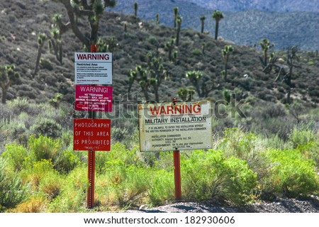 The warning signs at the entrance to Groom Lake, also known as Area 51. Royalty-Free Stock Photo #182930606