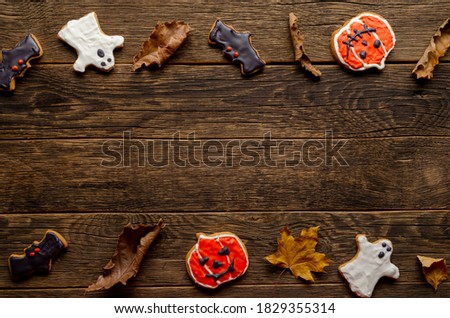 cookies for halloween on wooden background top view Pattern