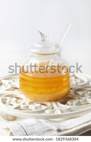 Glass jar with raw flower honey