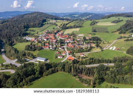 Picture of an aerial view with a drone of the village Grueb near Grafenau in the Bavarian forest with mountains and landscape, Germany