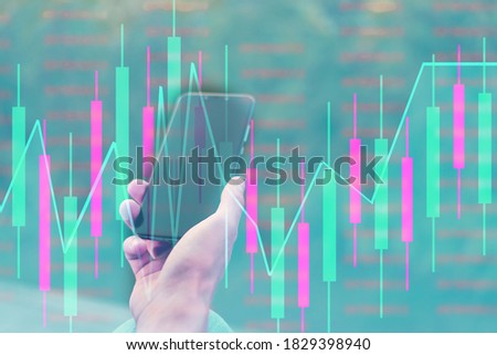 Business man holding phone and showing holographic graphs and stock market statistics gain profits. Concept of growth planning and business strategy.