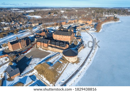 Above the ancient fortress of the city of Hameenlinna on a March day (aerial photography). Finland