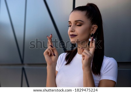 Portrait of a emotional girl isolated on a black wall