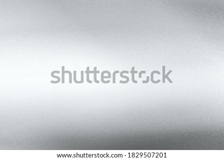 Glowing silver foil glitter paper sheet with copy space, abstract texture background