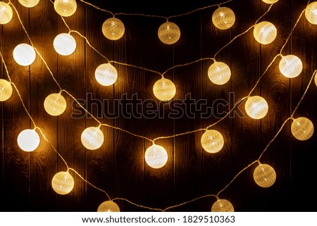 Hanging light bulb over the wooden background, mockup poster. Background wood planks with lamps
