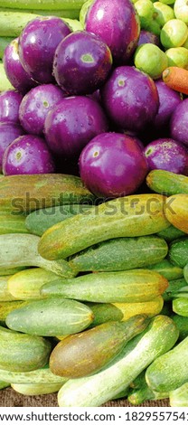 cucumber and other vegetable on ground 