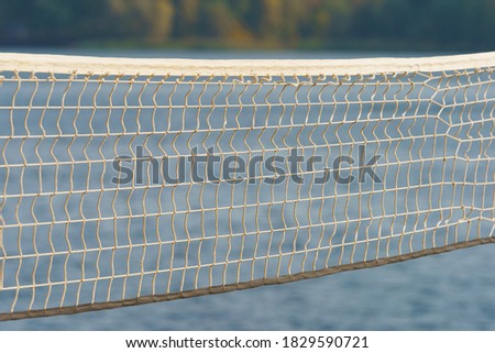 Photography of the beach volleyball net. Domestic Russian tourism. Touristic resort in front of Istra water Reservoir in day time. Holidays concept. Beautiful landscape. Autumn holidays
