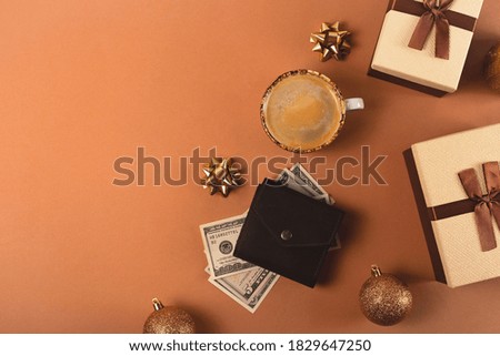 Planning a budget for Christmas gift shopping with brown boxes with ribbons and christmas decorations. Top view, flat lay, copy space