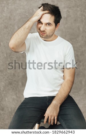 Picture of a man thinking hard at something