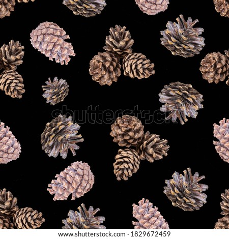 Christmas seamless pattern with pine cones on a black background.