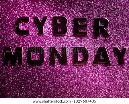 inscription - cyber monday, in silver letters on a pink glitter, with vignetting