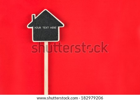 Pointer house with space for your text lies on red  background