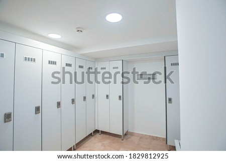 empty locker room and lockers of the gym Royalty-Free Stock Photo #1829812925